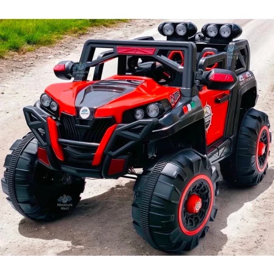 Red off-road kids ride-on jeep with black bumper, roof lights and large wheels