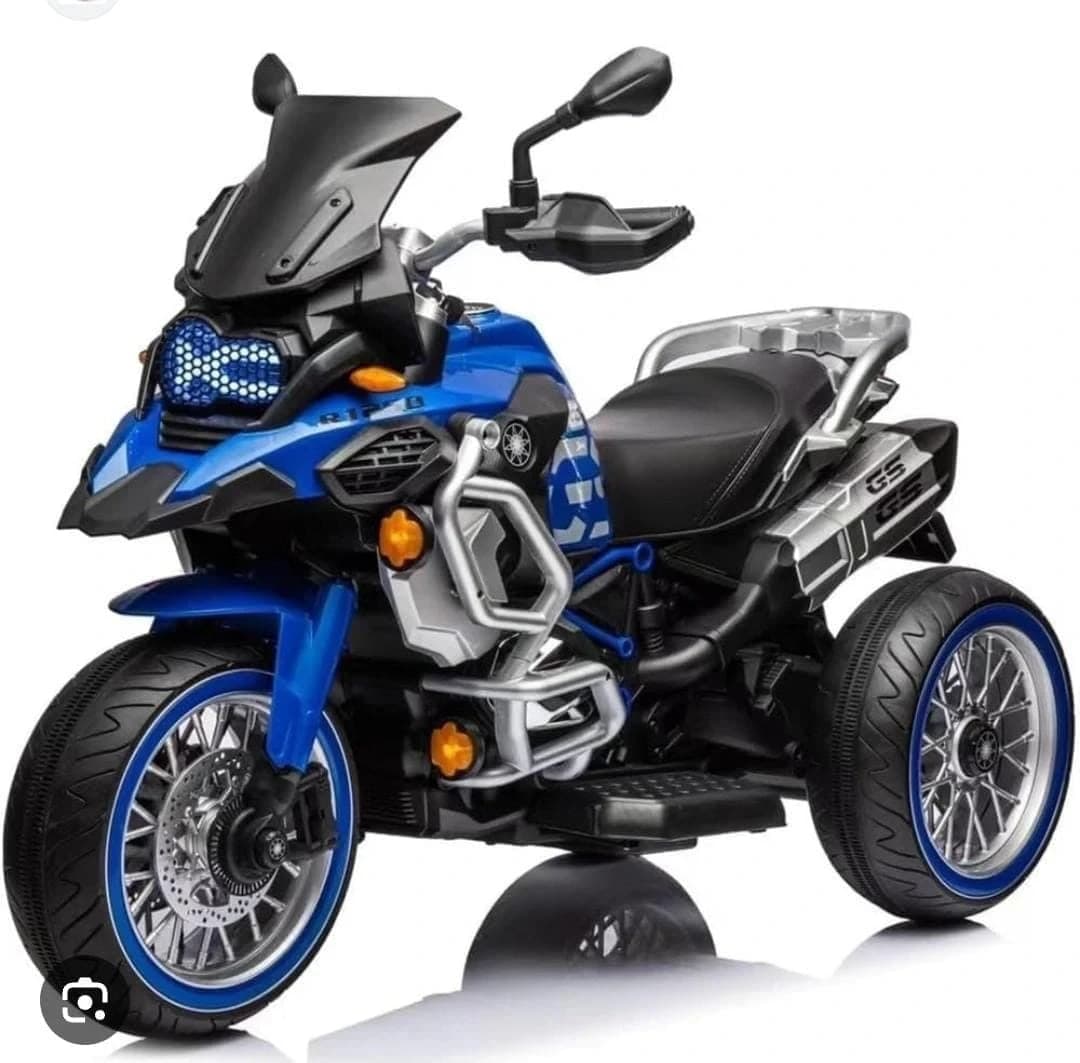 Blue adventure-style kids ride-on trike motorbike with windscreen and luggage rack