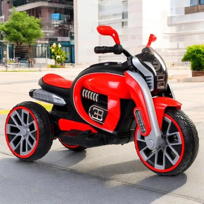 Red kids ride-on trike motorbike with red mirrors and red-rimmed wheels